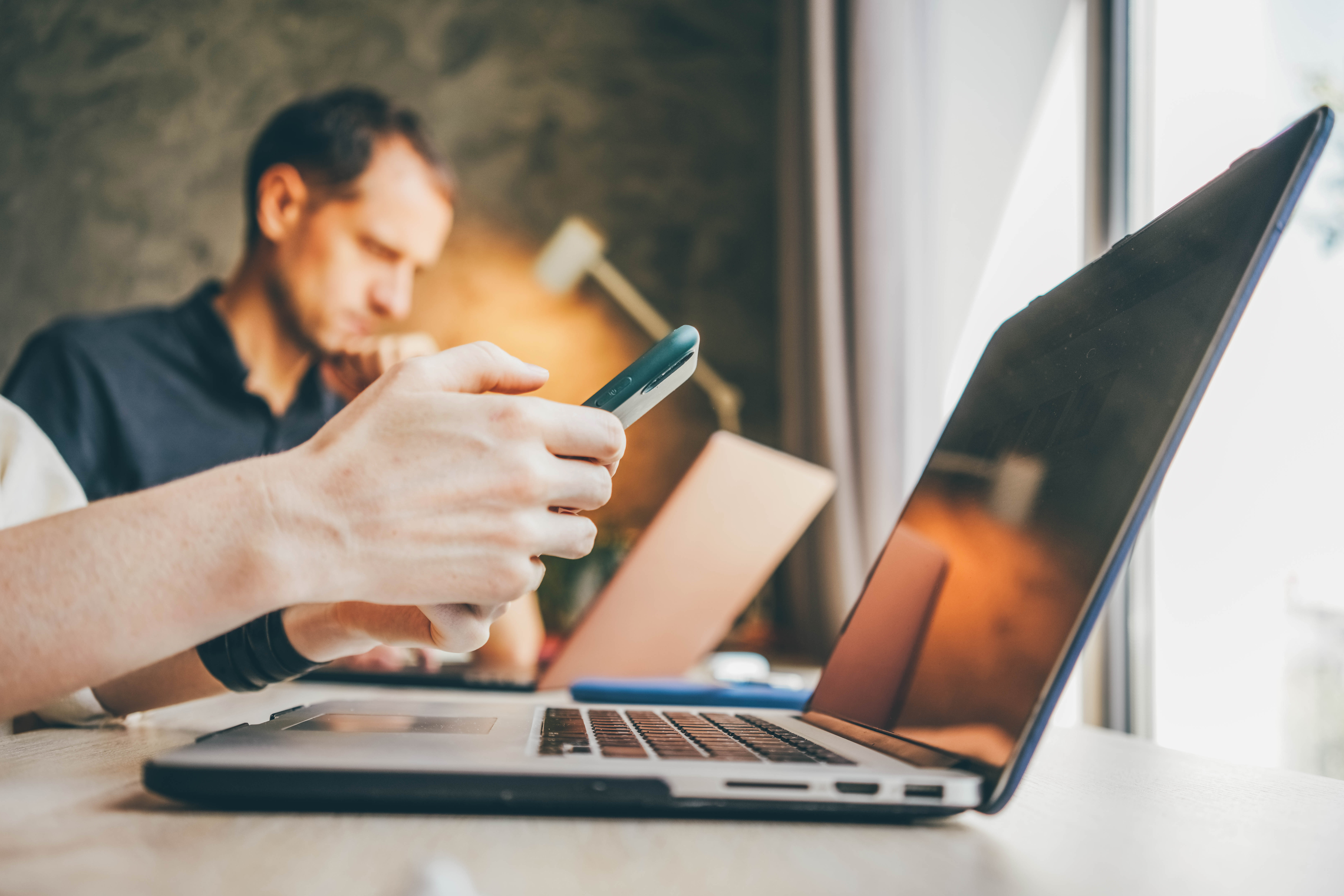 businesswoman-texts-message-on-smartphone-working-2023-11-27-05-18-25-utc